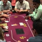Poker Game Texas Holdem Las Vegas Casino Video of Dealer dealing Cards to Players round a Card Table