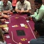 Poker Game Texas Holdem Las Vegas Casino Video of Dealer dealing Cards to Players round a Card Table