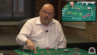 What is the Iron Cross betting strategy in craps?
